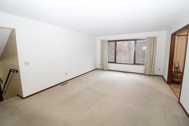 unfurnished bedroom featuring light colored carpet