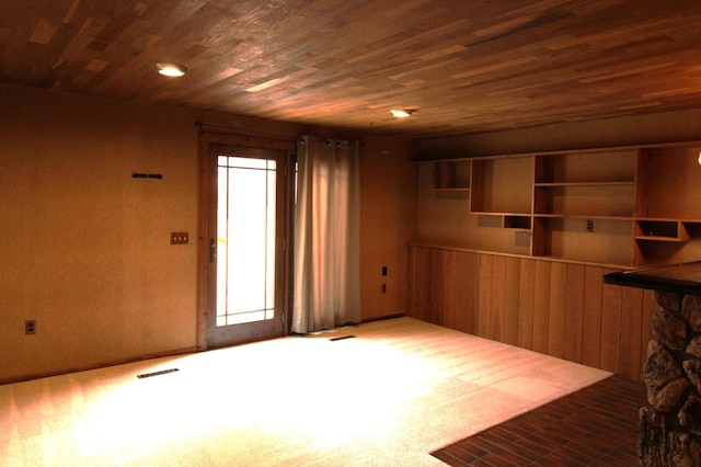 unfurnished room featuring wooden ceiling