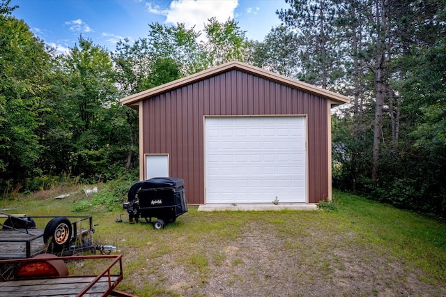 garage featuring a yard