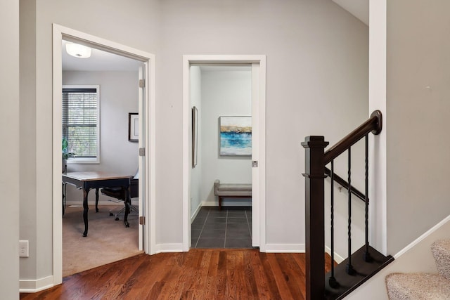 hall featuring dark wood-type flooring