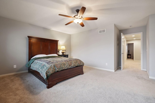 bedroom featuring ceiling fan and light carpet