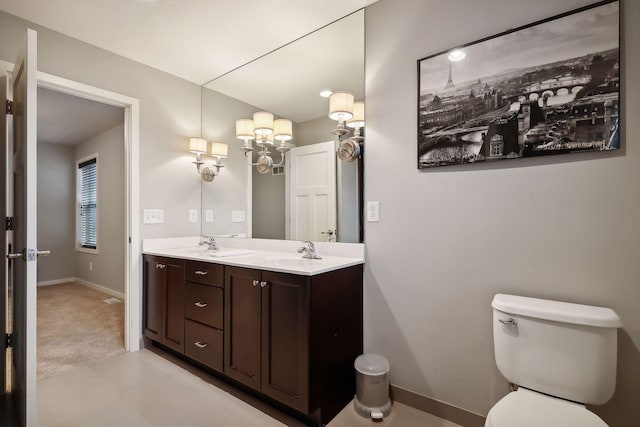 bathroom with vanity and toilet