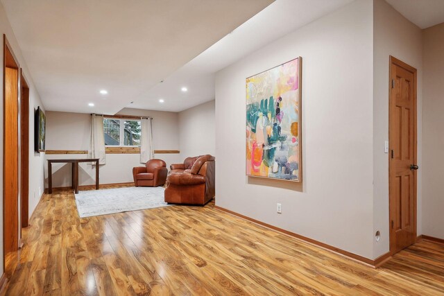 sitting room featuring light hardwood / wood-style flooring