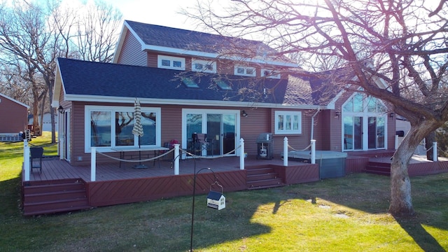 back of house with a lawn and a wooden deck