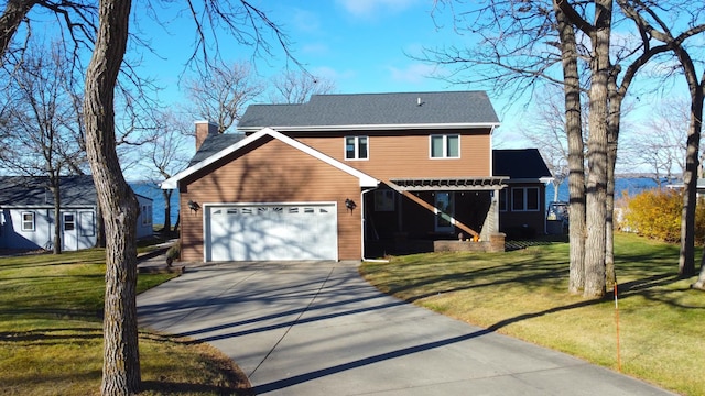 view of front of home with a front lawn and a garage