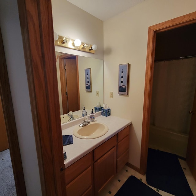 bathroom featuring tile patterned flooring and vanity