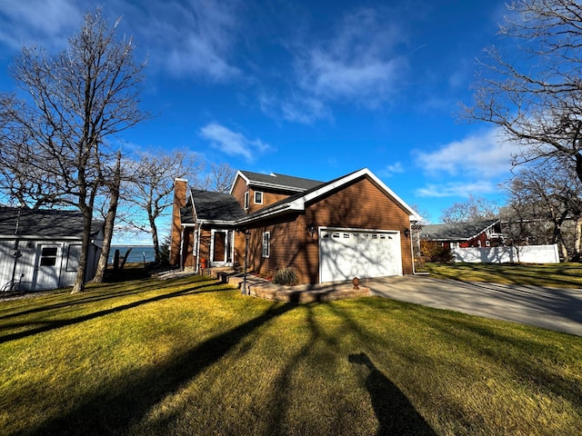 view of home's exterior featuring a garage and a lawn