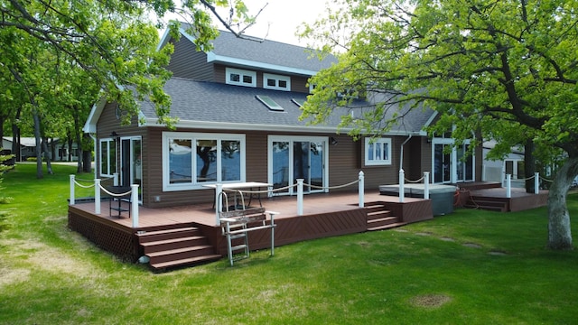 145 Bay View Rd, Ottertail, MN 56571 - back of house with roof with shingles, a wooden deck, and a yard
