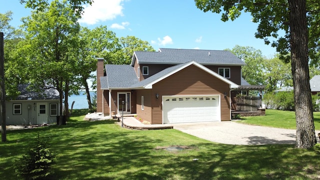 145 Bay View Rd, Ottertail, MN 56571 - view of front of property with a chimney, an attached garage, driveway, and a front yard