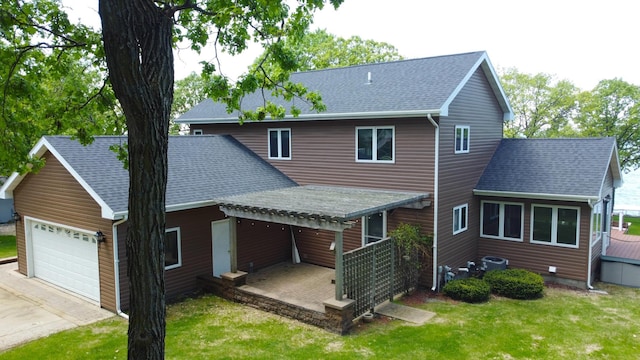 145 Bay View Rd, Ottertail, MN 56571 - back of property featuring a yard and a shingled roof