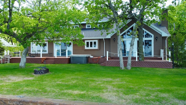 145 Bay View Rd, Ottertail, MN 56571 - rear view of house with a lawn, a chimney, a shingled roof, and central air condition unit