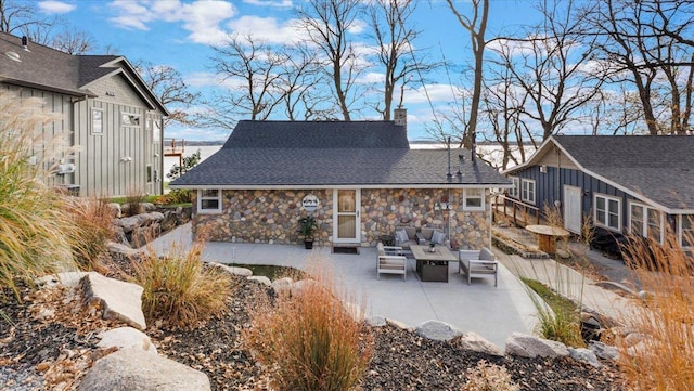 11470 Forada Beach Rd SE, Alexandria, MN 56308 - back of property featuring an outdoor hangout area, a chimney, a patio area, and stone siding