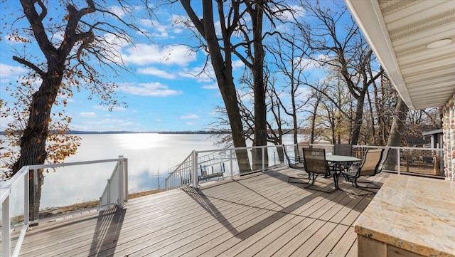 11470 Forada Beach Rd SE, Alexandria, MN 56308 - wooden terrace with a water view and outdoor dining area