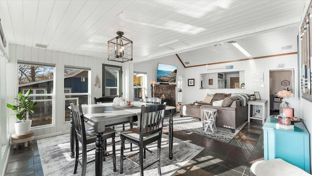 11470 Forada Beach Rd SE, Alexandria, MN 56308 - dining room featuring an inviting chandelier, wooden ceiling, and wood walls