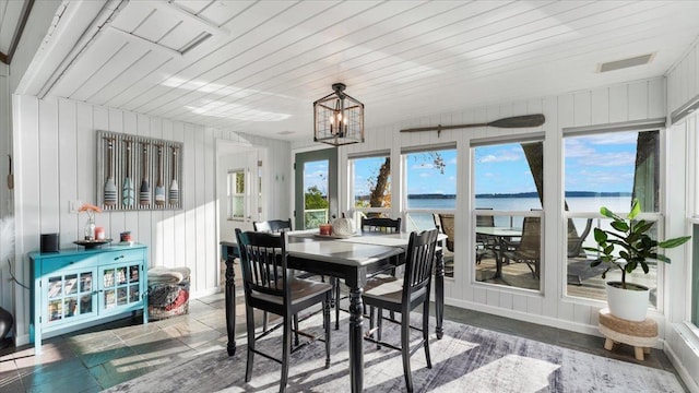 11470 Forada Beach Rd SE, Alexandria, MN 56308 - sunroom / solarium featuring a water view and a chandelier