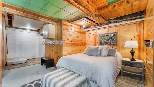 11470 Forada Beach Rd SE, Alexandria, MN 56308 - bedroom with wood walls and unfinished concrete floors