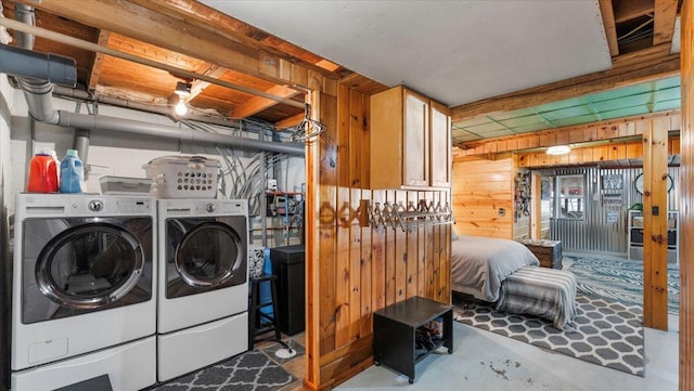 11470 Forada Beach Rd SE, Alexandria, MN 56308 - laundry area with independent washer and dryer, wooden walls, and laundry area