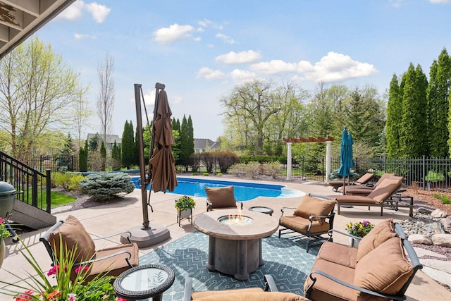 view of pool with a patio, an outdoor fire pit, fence, and a fenced in pool