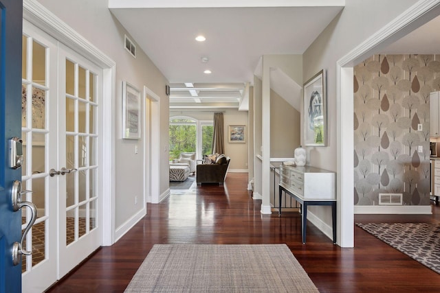 entrance foyer with baseboards, visible vents, dark wood-style flooring, and french doors