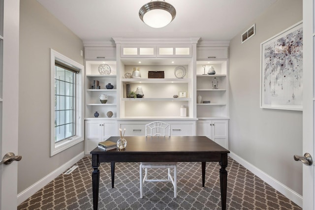 office space featuring visible vents and baseboards