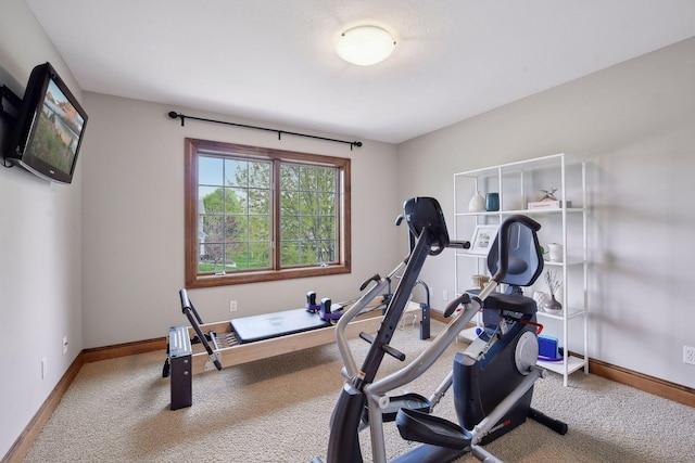 workout area with carpet and baseboards