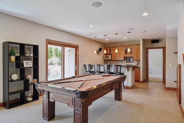 game room with light carpet, wet bar, a textured ceiling, and recessed lighting