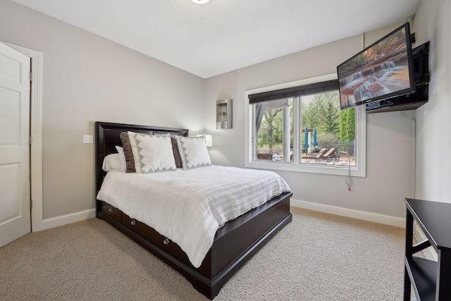 bedroom featuring carpet flooring and baseboards