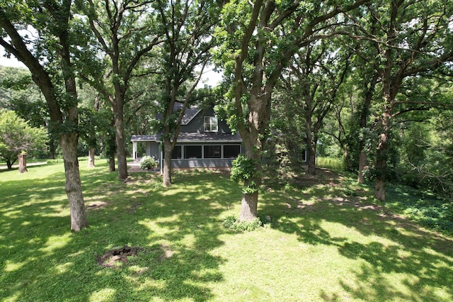 view of yard featuring a sunroom