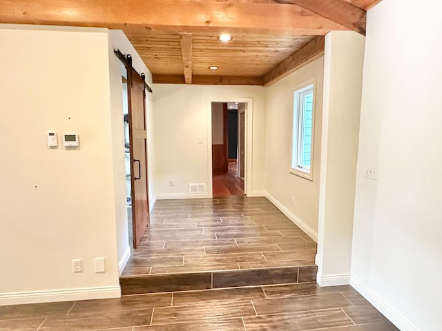 hall with wood finish floors, a barn door, recessed lighting, wood ceiling, and baseboards