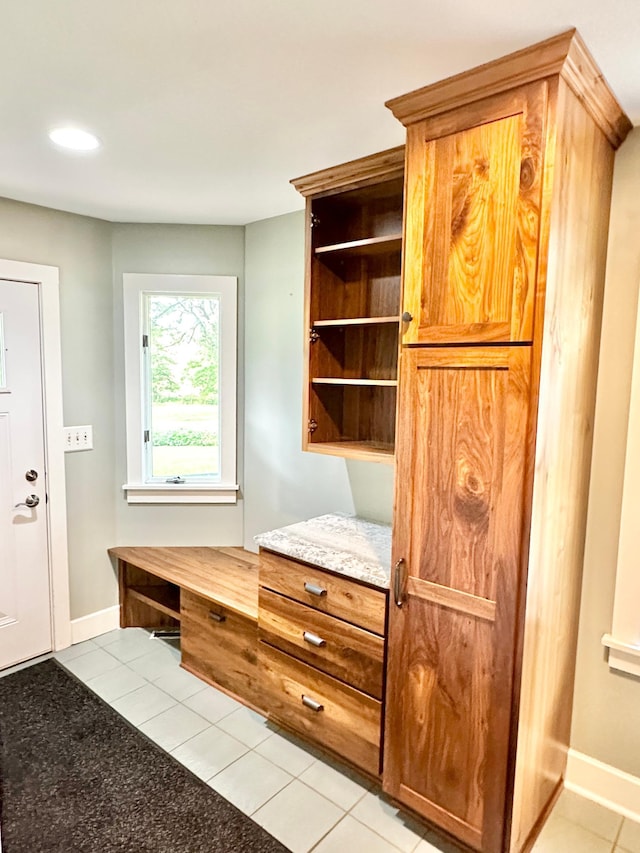 mudroom with baseboards, light tile patterned flooring, and recessed lighting