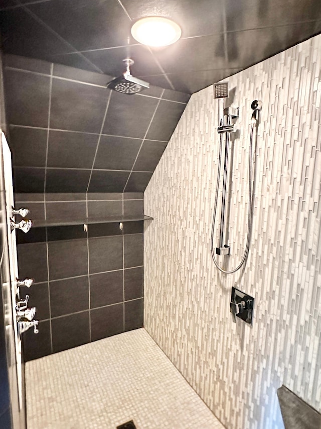 full bath with a tile shower