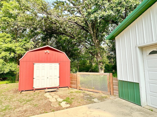 view of shed with a gate and fence