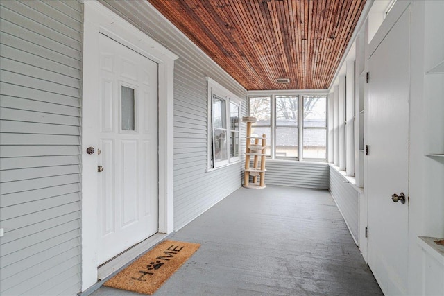 sunroom / solarium featuring wood ceiling