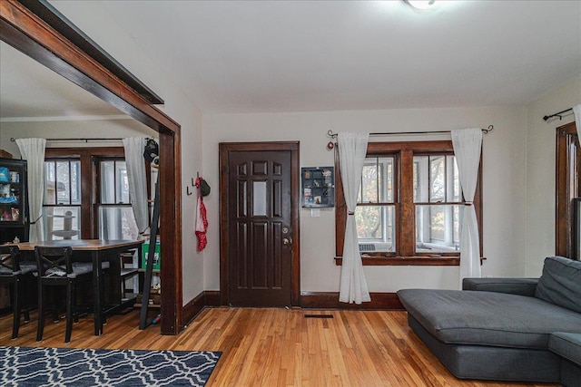 foyer entrance with hardwood / wood-style flooring