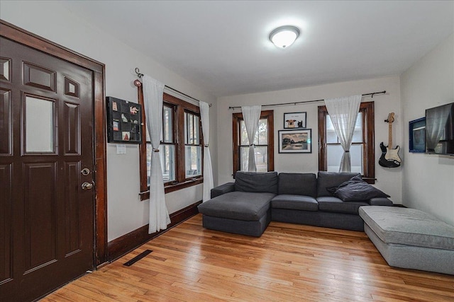 living room with light hardwood / wood-style flooring