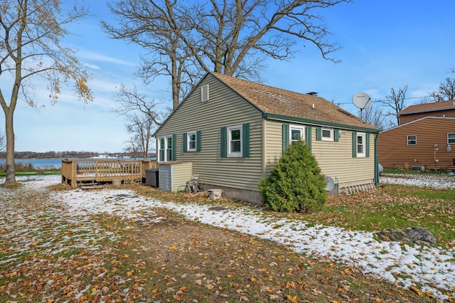 view of snowy exterior featuring a deck