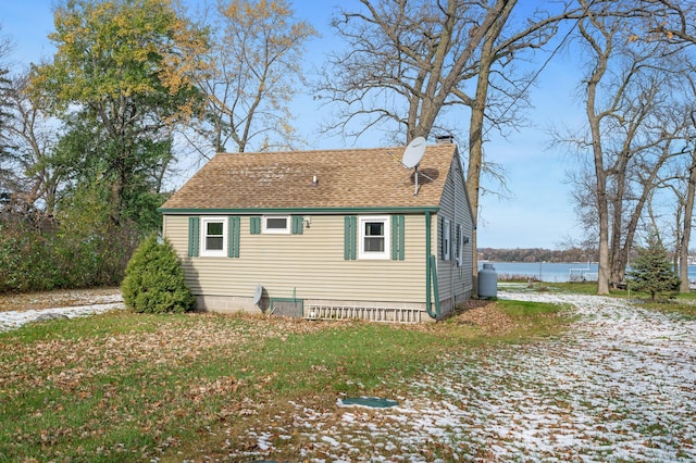 view of side of property with a water view