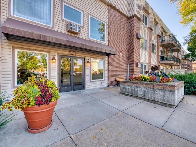 exterior space featuring cooling unit and french doors