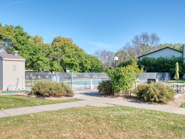 view of yard featuring a community pool