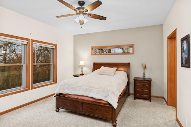 bedroom featuring light carpet and ceiling fan