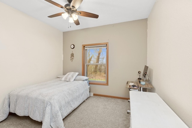 bedroom with light colored carpet and ceiling fan