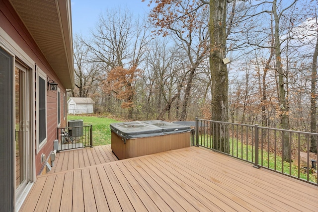 wooden terrace with a hot tub