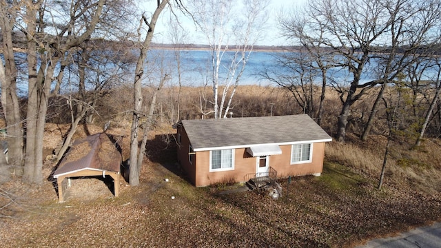 view of home's exterior with a water view