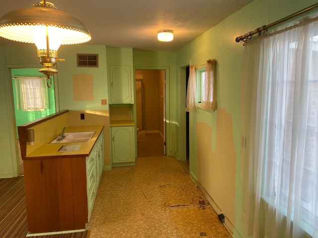 kitchen with hanging light fixtures and sink