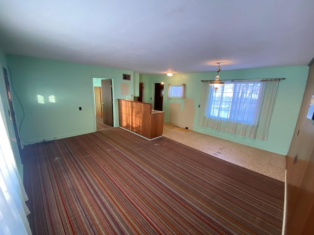 unfurnished living room with carpet floors