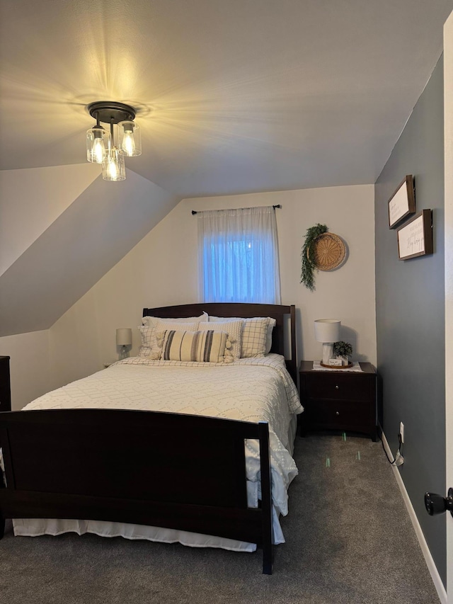 carpeted bedroom with vaulted ceiling