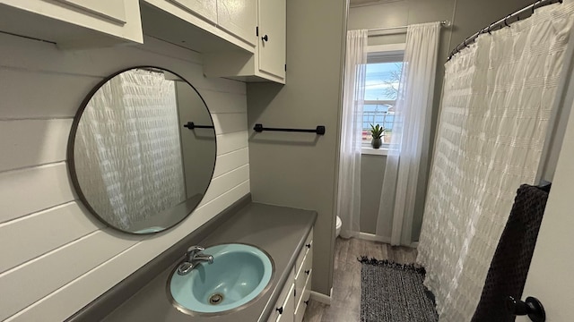 bathroom with vanity, a shower with curtain, hardwood / wood-style flooring, and toilet