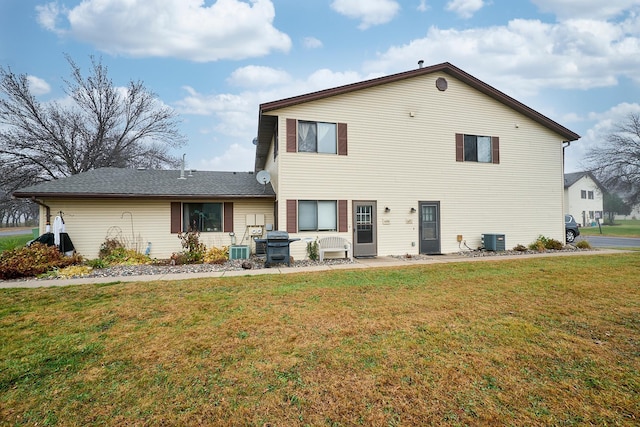 back of property featuring a yard, central AC, and a patio area