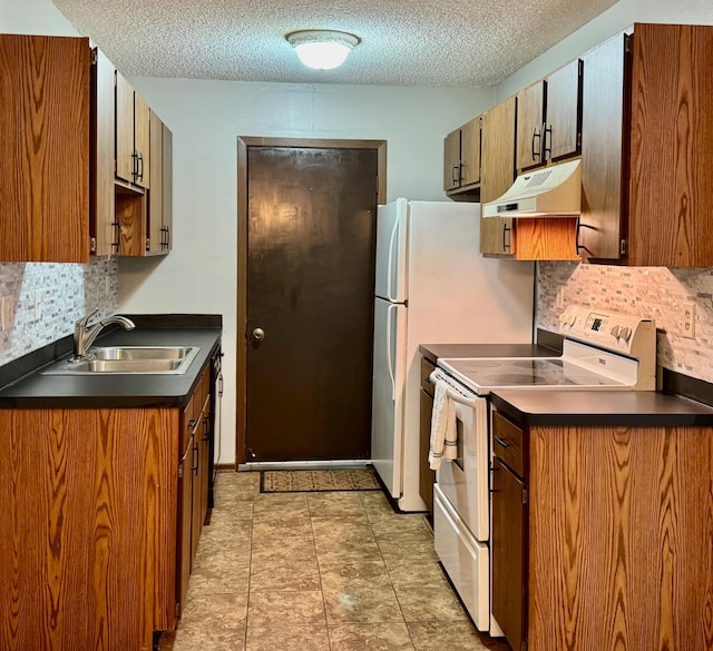 kitchen with backsplash, electric range, sink, and a textured ceiling