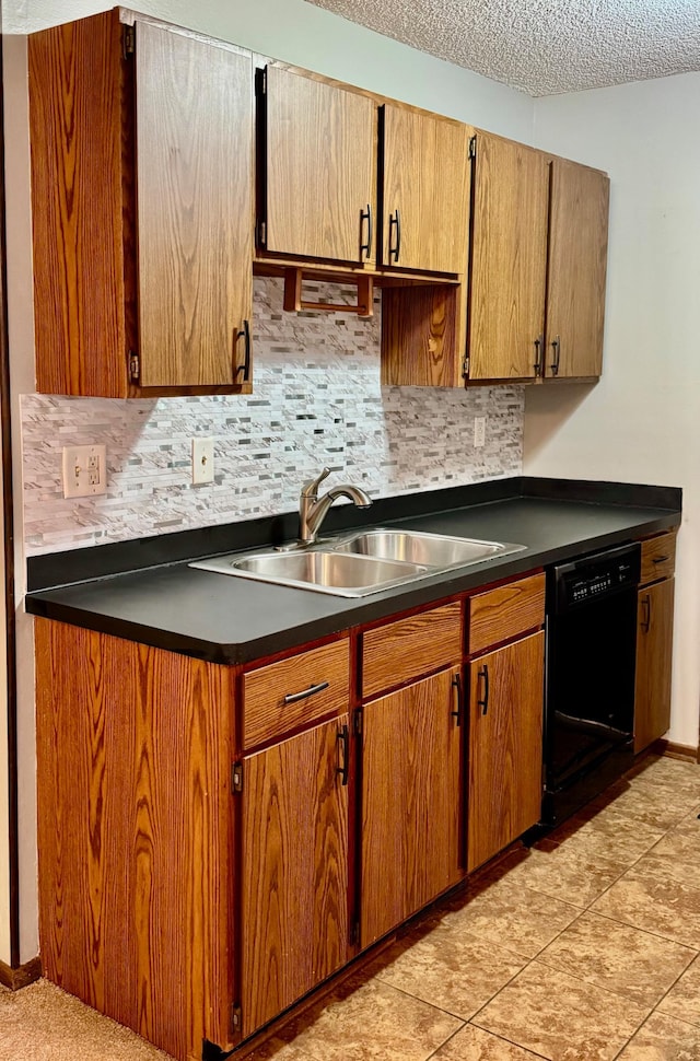 kitchen with sink, a textured ceiling, decorative backsplash, and black dishwasher